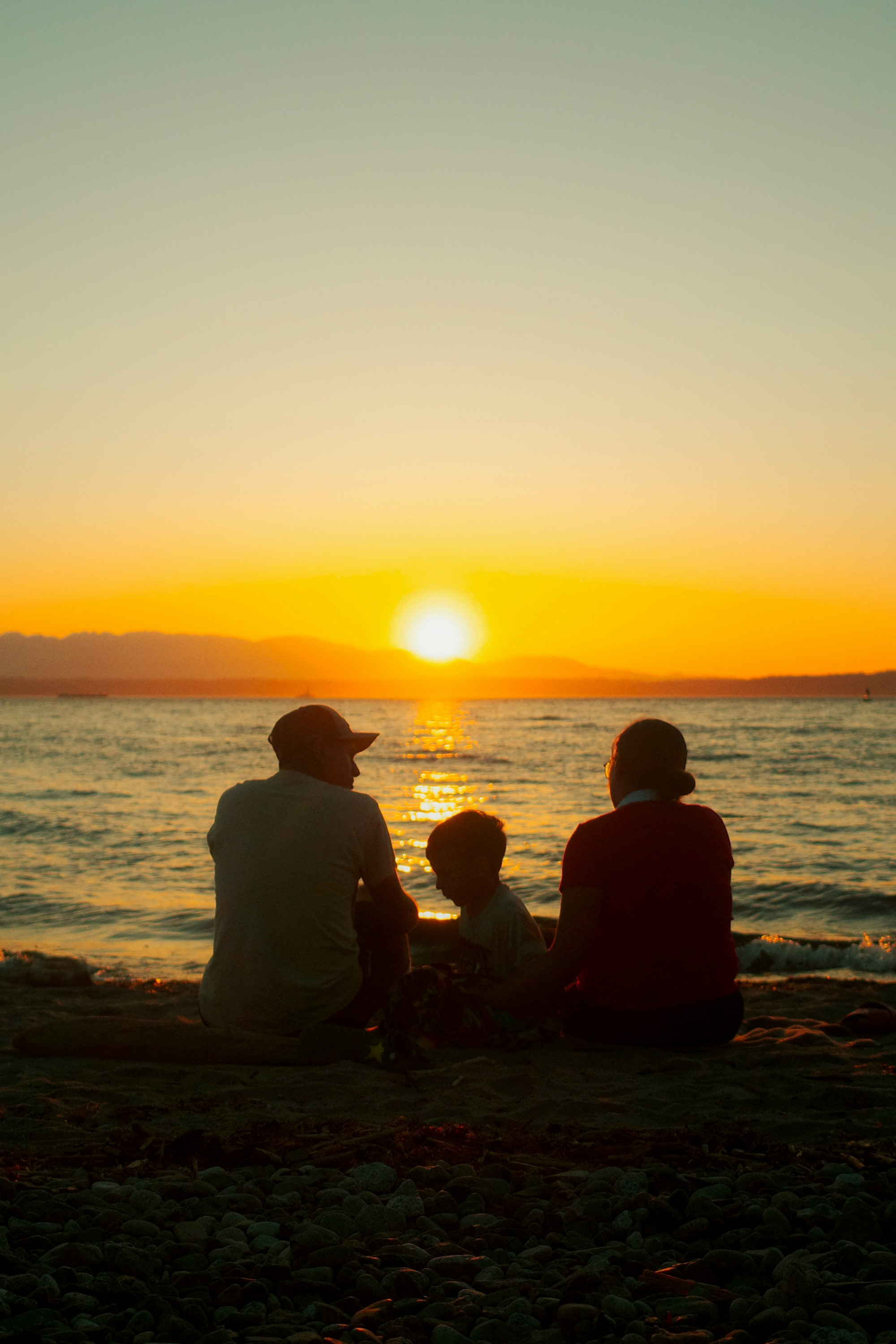 Clearwater family watching the sunset — moving forward confidently after a car accident