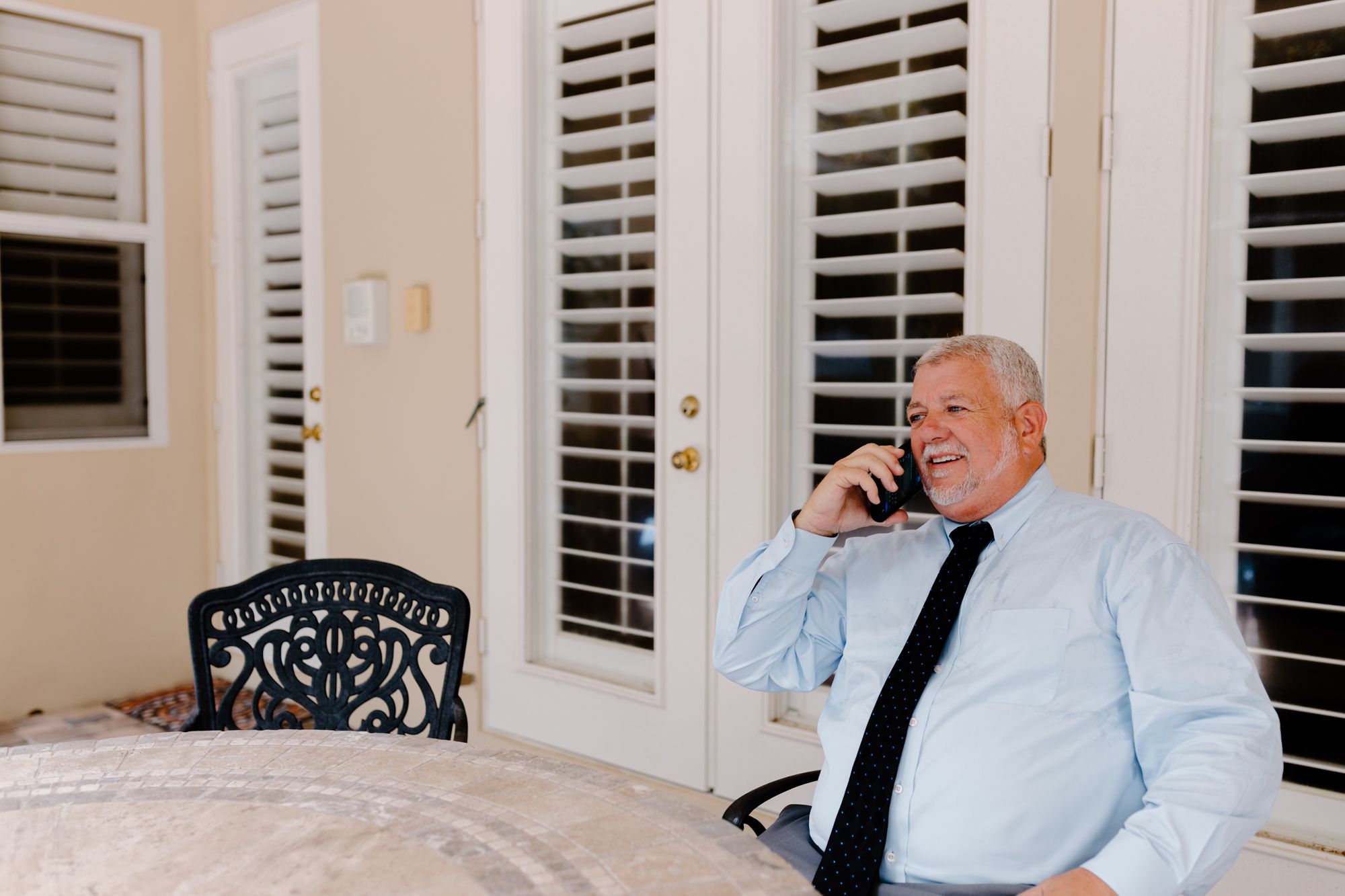 Attorney Papa speaks directly with a personal injury client by phone.