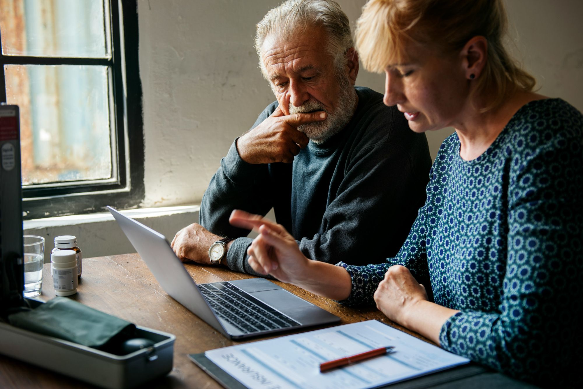 Injured accident victim reviews medical bills and household expenses.